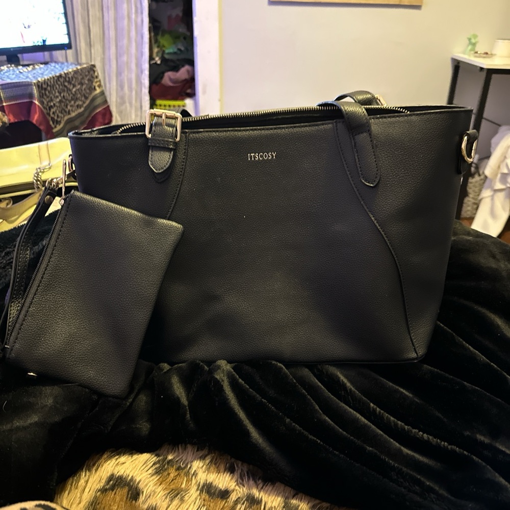 Black purse with wrist wallet on side